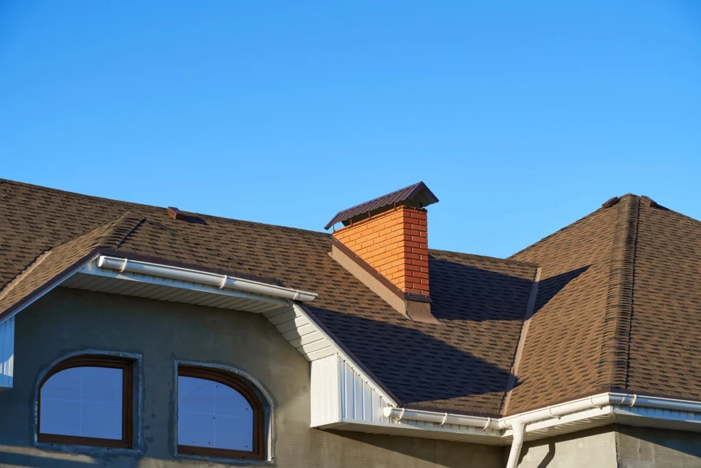 new installed brown asphalt shingle roof